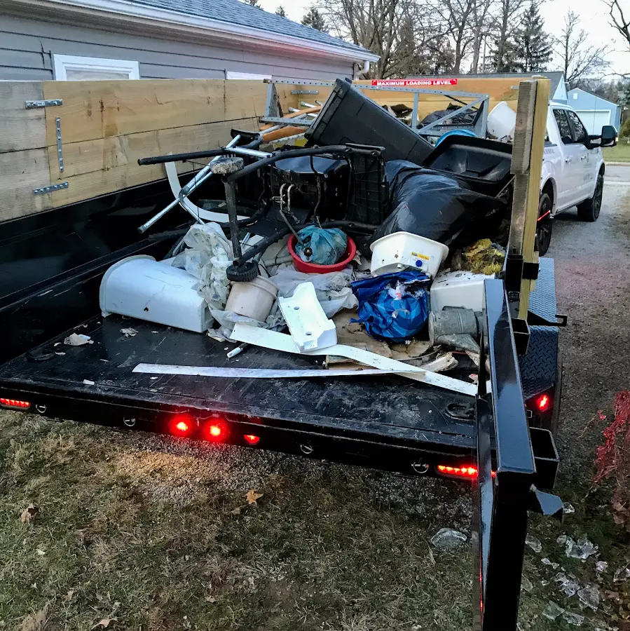 Roll-off dumpster delivered to a residential driveway in Clay